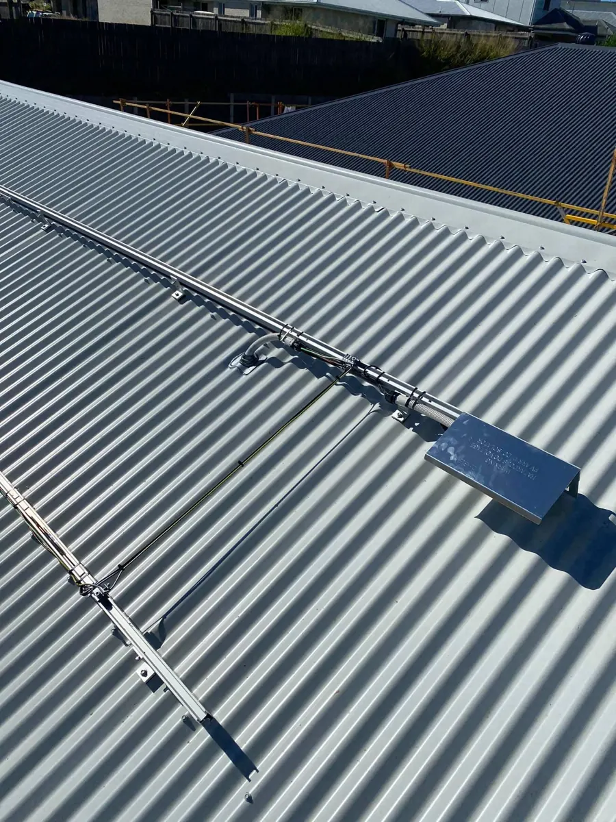Neat solar mounting rail and cable detail on a metal roof